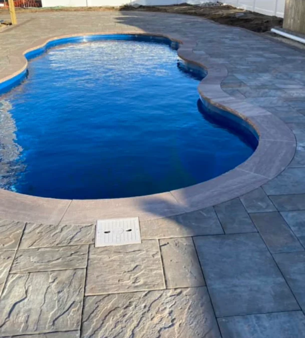 pool area with concrete flooring